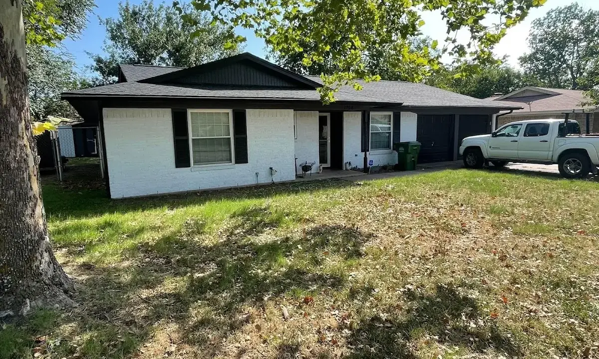 Professional roofing crew working on a residential roof in Maidencreek